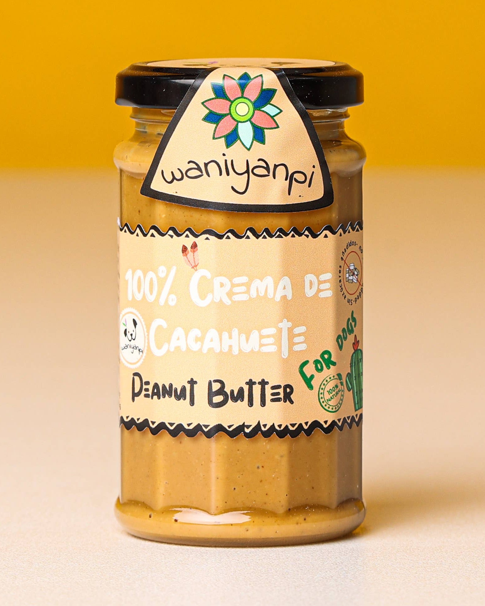 Jar of peanut butter with a colorful label on a yellow background