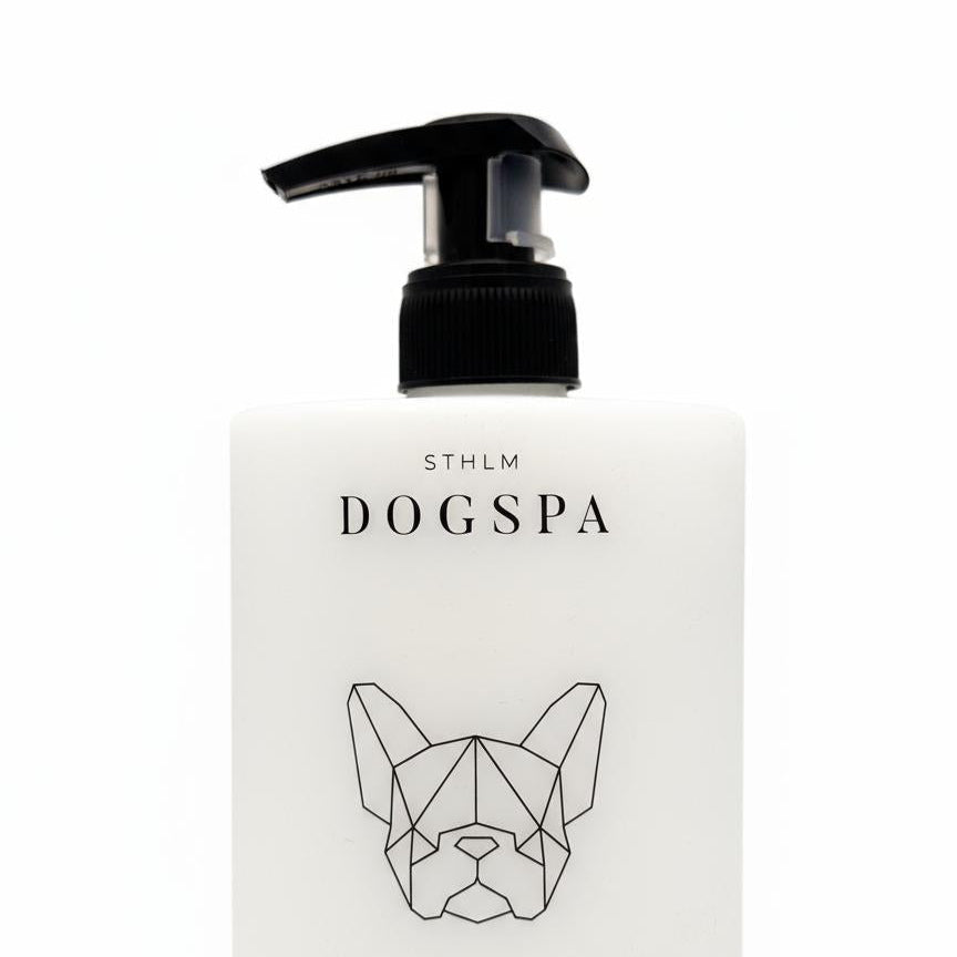 Dog spa sensitive conditioner bottle with geometric dog face design on a white background